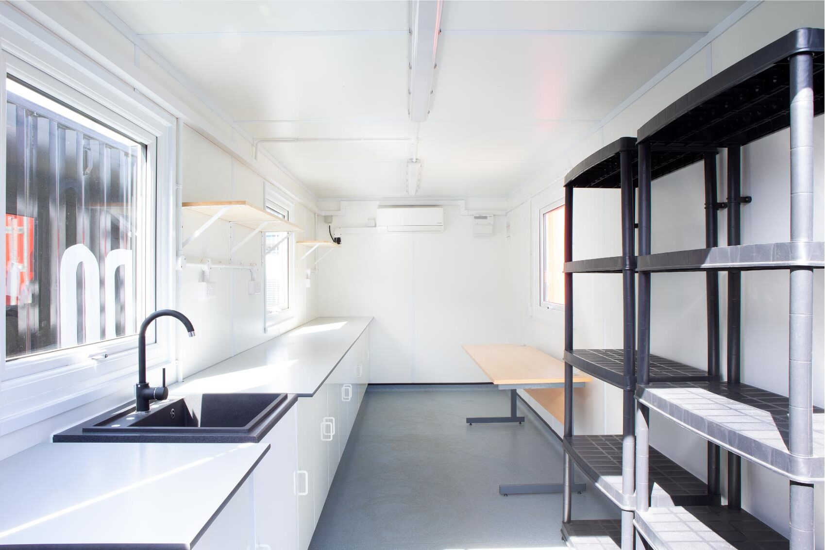 Black container with with interior and black shelving