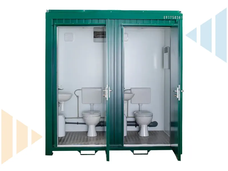 Internal view of a twin green portable toilet cabin featuring two fully fitted WC cubicles with flush toilets, hand basins, plumbing and ventilation. Ideal for construction sites, events, or temporary facilities needing instant deployment.