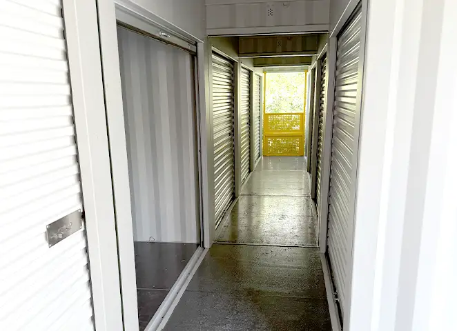 Interior walkway of a topper container unit with roller shutter storage doors, designed for self storage sites in the GB.
