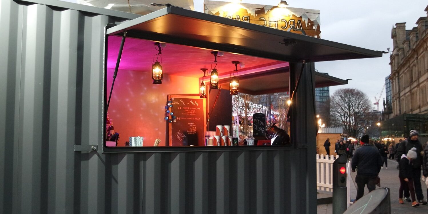 Arctic bar hatch with customers walking by